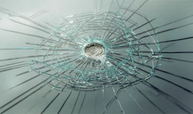 bullet resistant glass showing the impact of bullet in the middle