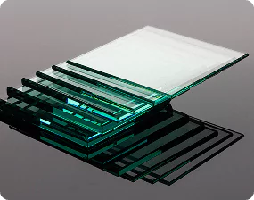 Stack of tempered and laminated glass sheets arranged neatly, showcasing durable safety glass options
